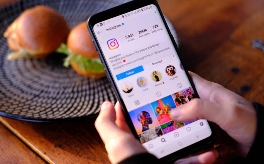 A person using a smartphone to access Instagram, a popular social media platform